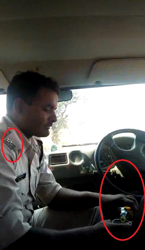 सरकारी वाहन में आन ड्यूटी, वर्दीधारी पुलिस आरक्षक का शराब पीते वीडियो वायरल, देखें